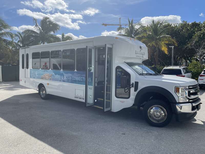 This is a Ford Super Duty shuttle bus used by the Loggerhead Marinelife Center, This is mounted on a Forest River (Starcraft, Glaval or StarTrans) body.