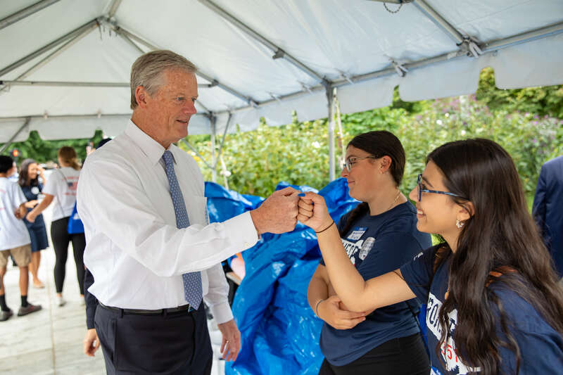 "Governor Charlie Baker and First Lady Lauren Baker join state and local officials to make care packages for members of the military with the Massachusetts Military Heroes Fund and Project 351 in Boston on Sept. 11, 2022."