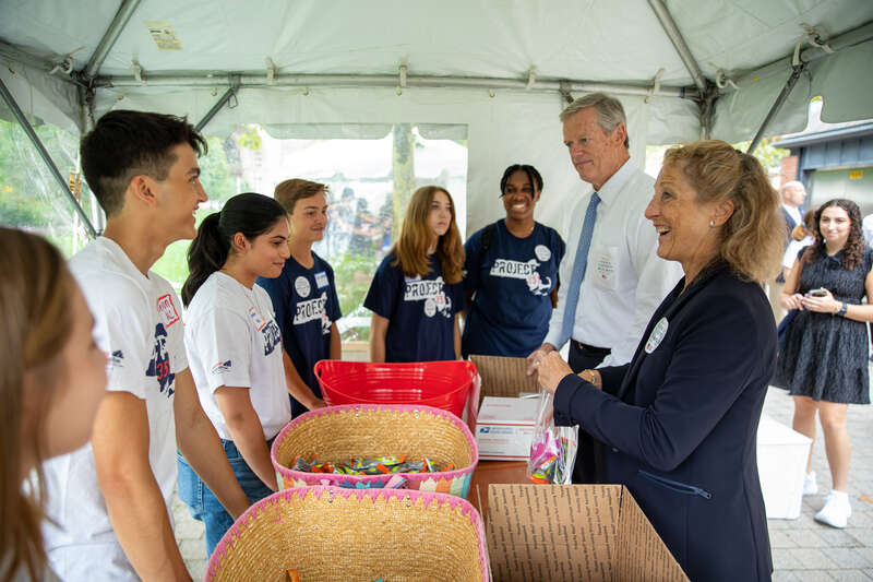 "Governor Charlie Baker and First Lady Lauren Baker join state and local officials to make care packages for members of the military with the Massachusetts Military Heroes Fund and Project 351 in Boston on Sept. 11, 2022."