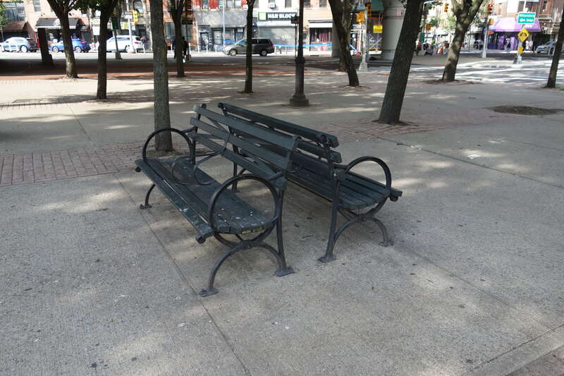 Walking through the sitting plaza at the east end of LaGuardia Playground South, at the northwest corner of Havemeyer Street and South 5th Street in Williamsburg, Brooklyn. The park was originally the northern half of the Williamsburg Bride Plaza