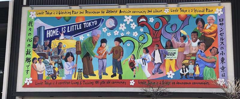 A mural along a wall on Alameda St.