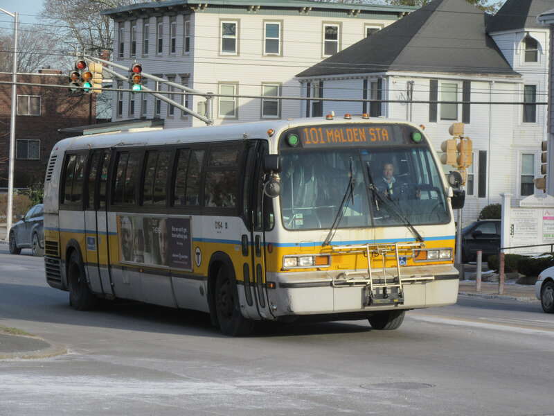 MBTA route 101 bus on Pleasant Street at Highland Avenue in Malden in March 2017