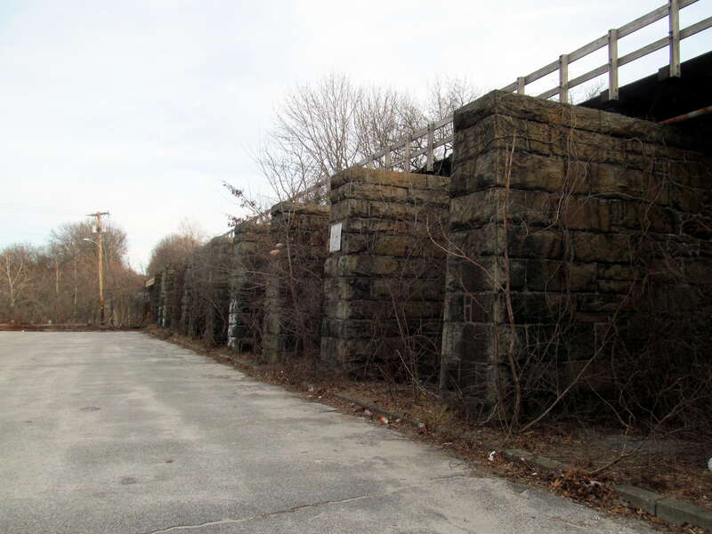 Providence &amp; Worcester Railroad bridge in Woonsocket, Rhode Island in February 2016. The footings originally held two tracks, but now only one.