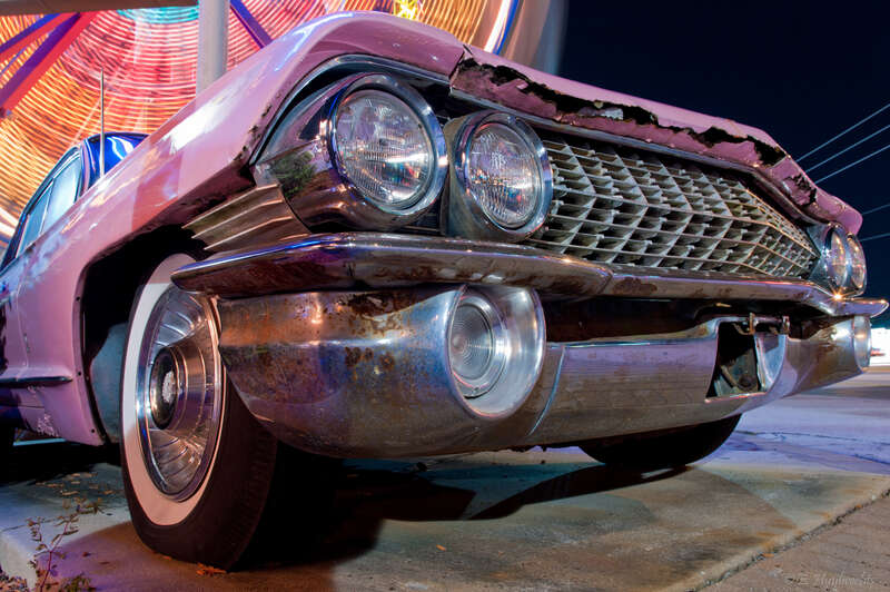 This is a 1961 Cadillac. Probably a 2-door Hartop Coupe (Model 61-62G, Style 6237G). 16 thousands were made and costed 5892$

(source: 100megsfree4.com/cadillac//cad1960/cad61s.htm )