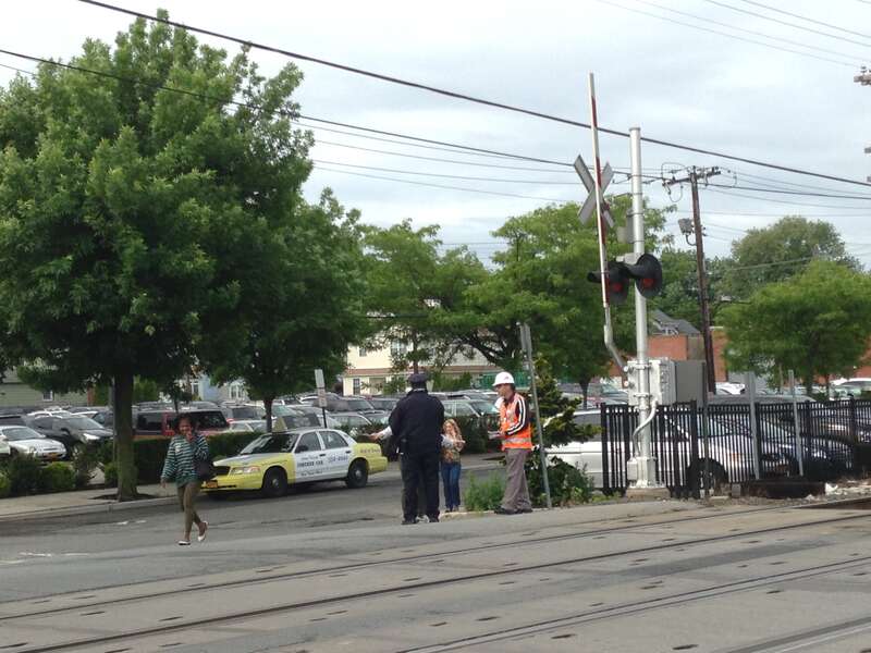 MTA police officers and railroad officials took part in International Level Crossing Awareness Day, or Railroad Crossing Awareness Day, by educating motorists, pedestrians and train customers with safety information. This photo was taken at Long