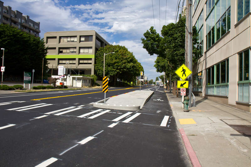 Bus Bulb or not?  Does this qualify as a cycle track?

I like this config though.  Reminds me of San Francisco's streetcars; especially the N Judah.