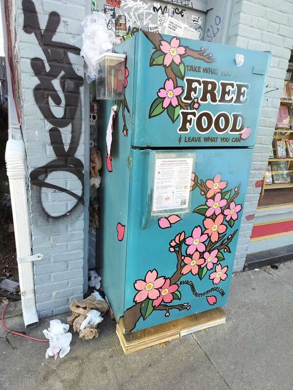 West Cary Street RVA Community Fridge in front of Shelf Life BOoks.