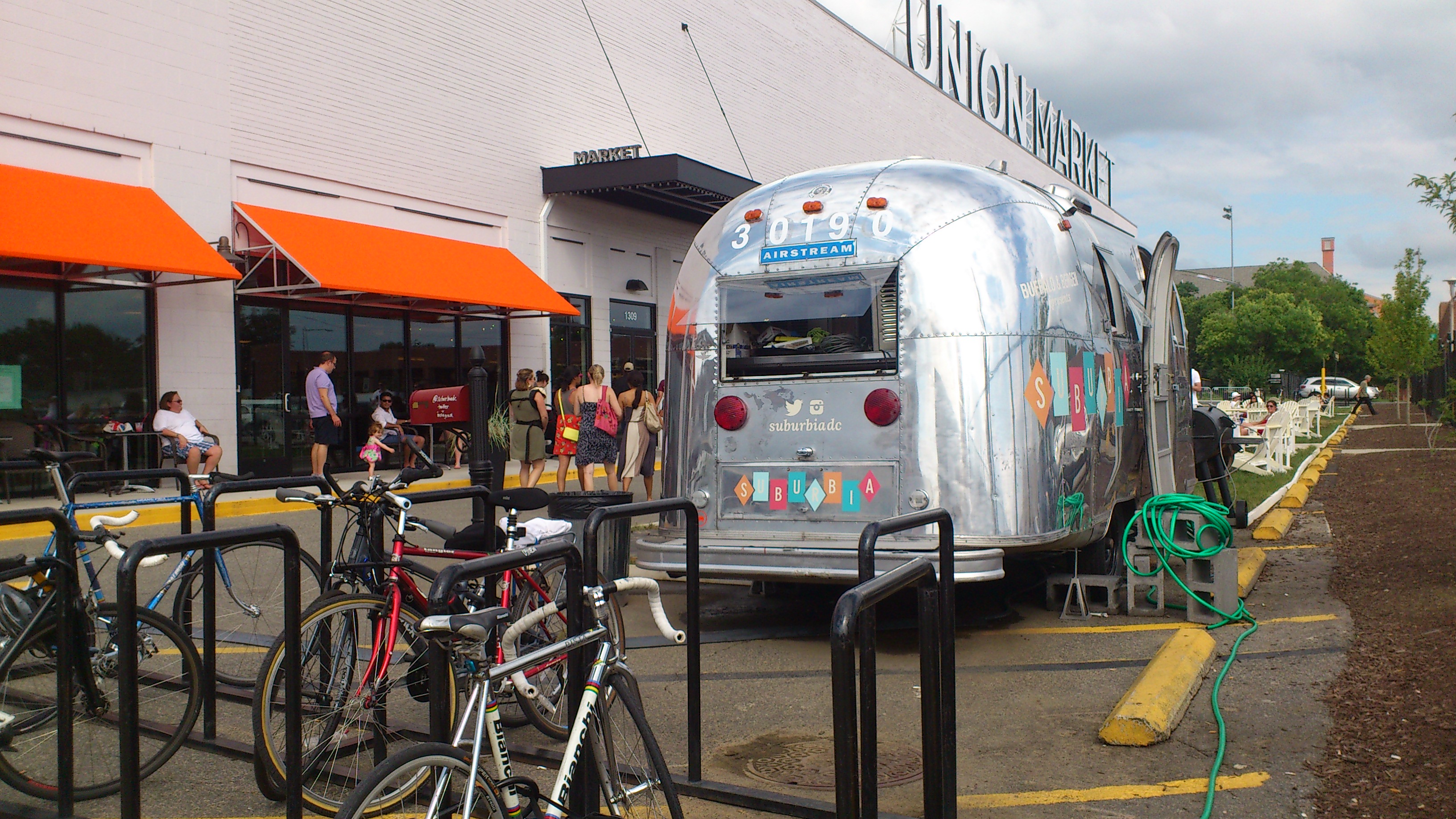 First Union Market literally paints the building white, then they trot out "suburbia" out front.