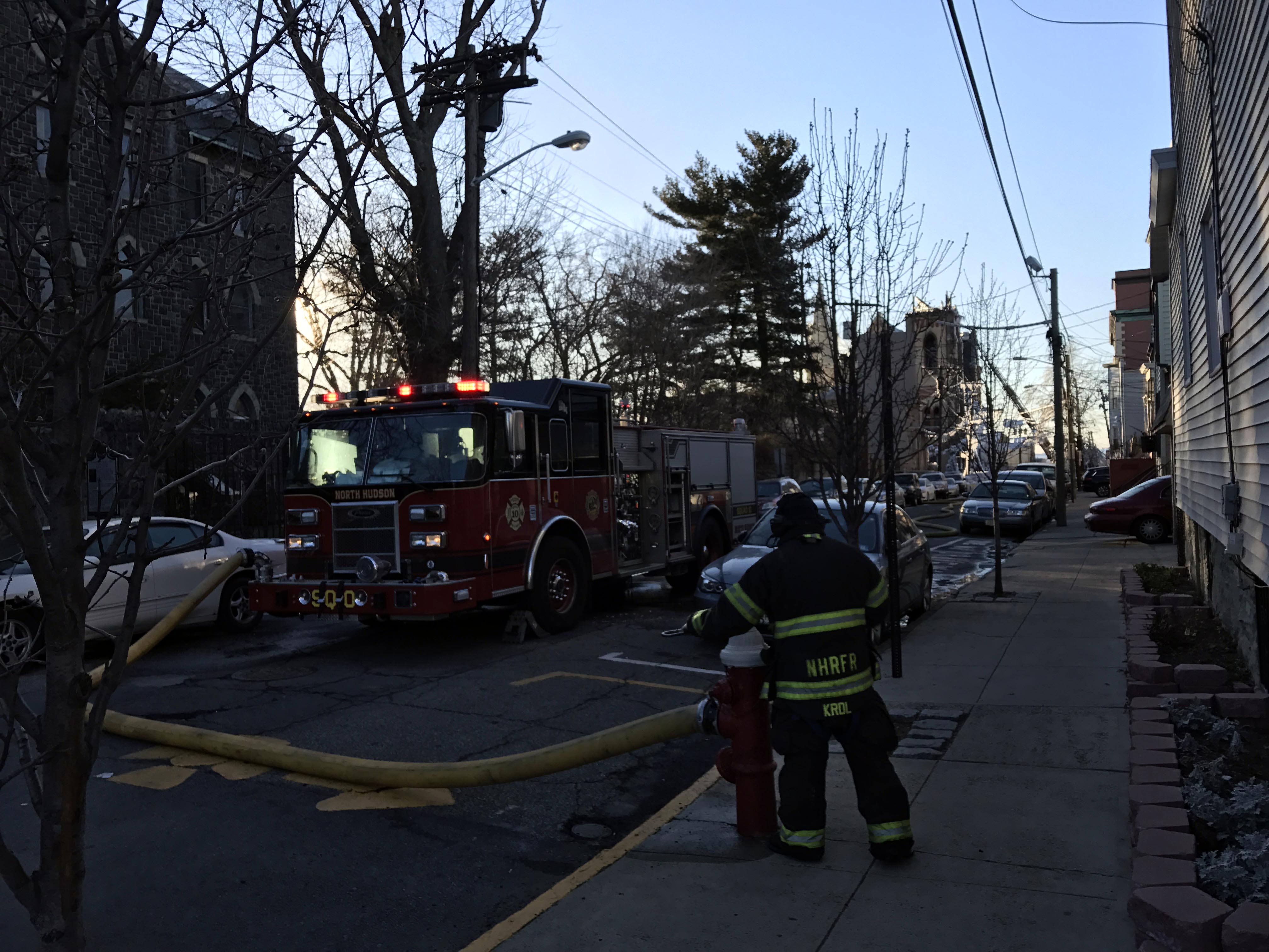 Looking west on 14th Street from the corner of West Street in Union City, New Jersey, in the late afternoon of March 4, 2017. In the background is the remains of SS. Joseph and Michael Parish Church on Central Avenue, to which a six-alarm fire that