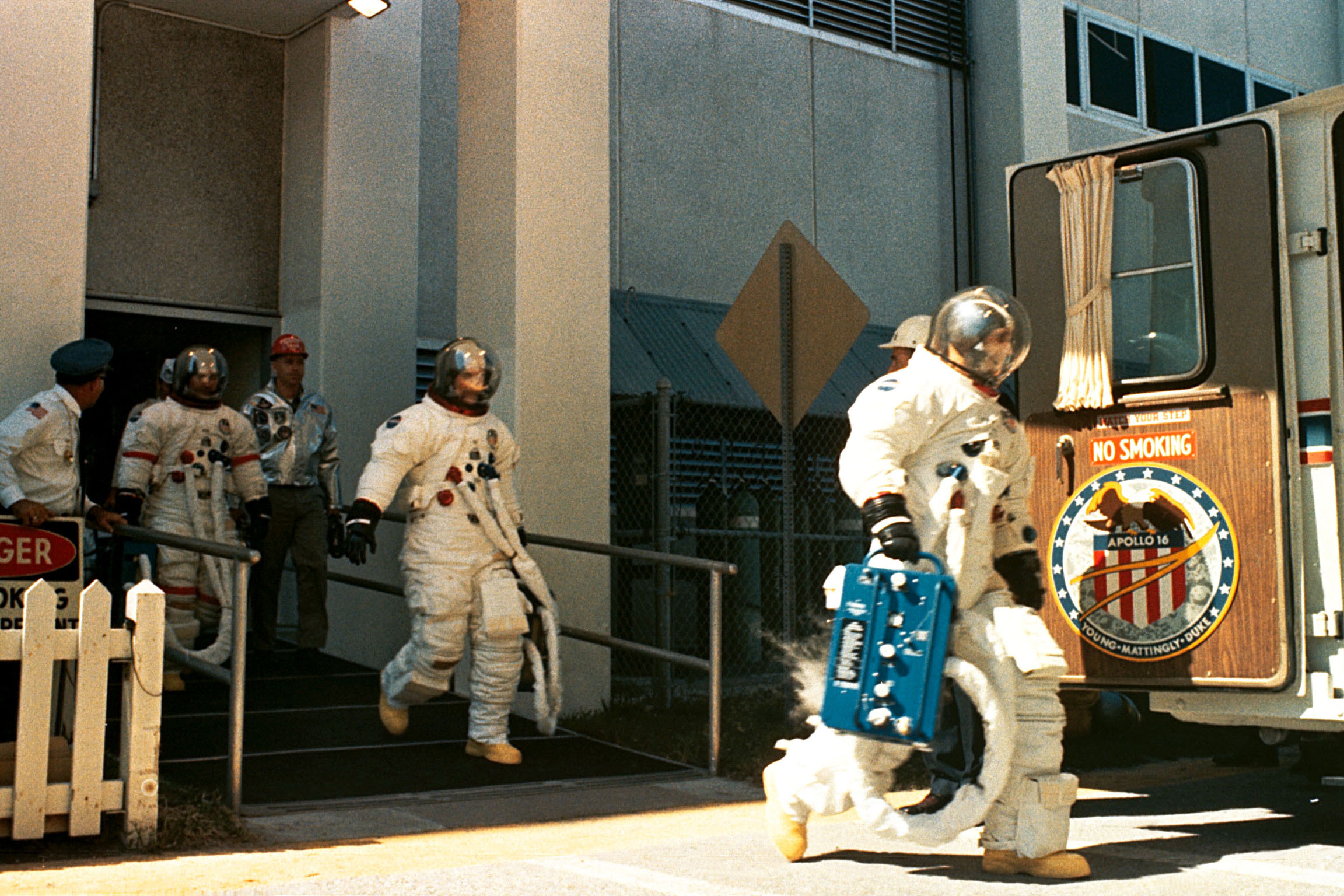 Apollo 16 crew members John Young (left), Ken Mattingly, and Charlie Duke walkout on launch day.