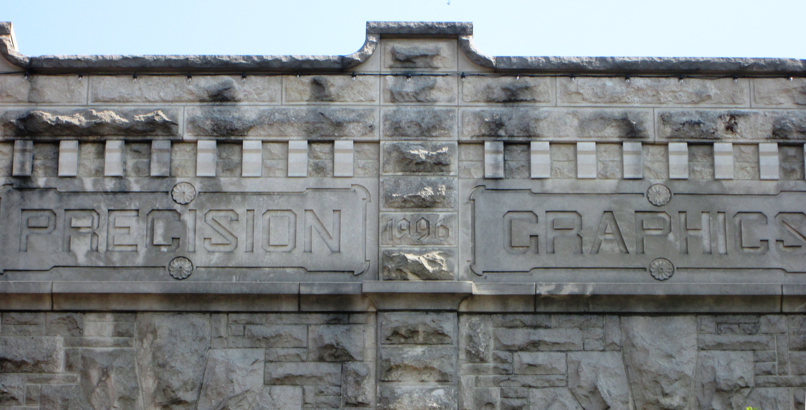 The Atkinson Building also known as the Atkinson Monument Building, at 106-108 S. Neil Street in Champaign, Illinois.  The portion of the uilding at #106 was built in 1904 for the S. P. Atkinson Monument Co., and the matching addition, also known as