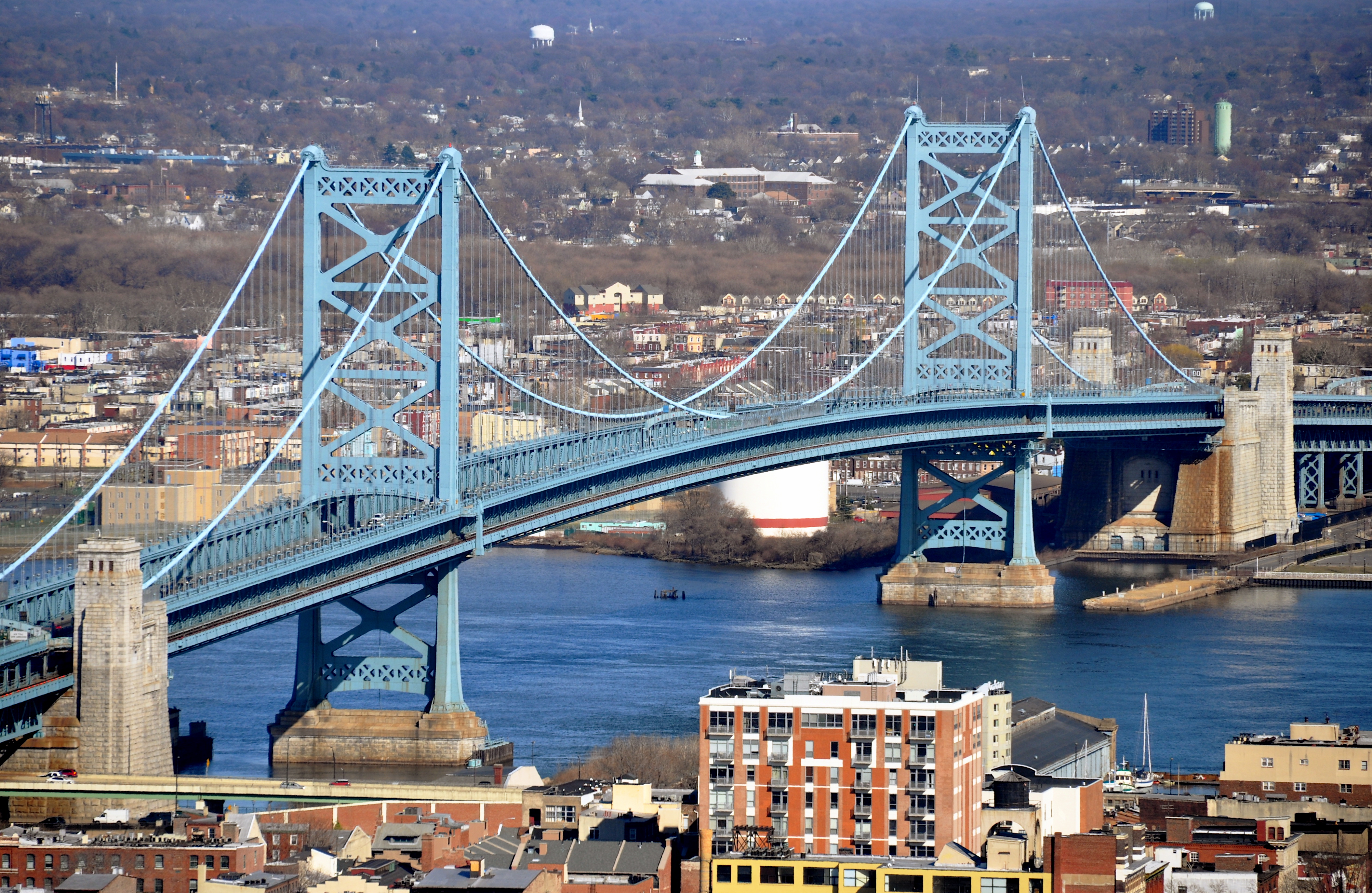 The Benjamin Franklin Bridge is a suspension bridge across the Delaware River connecting Philadelphia, Pennsylvania and Camden, New Jersey. View is from Philadelphia City Hall tower.