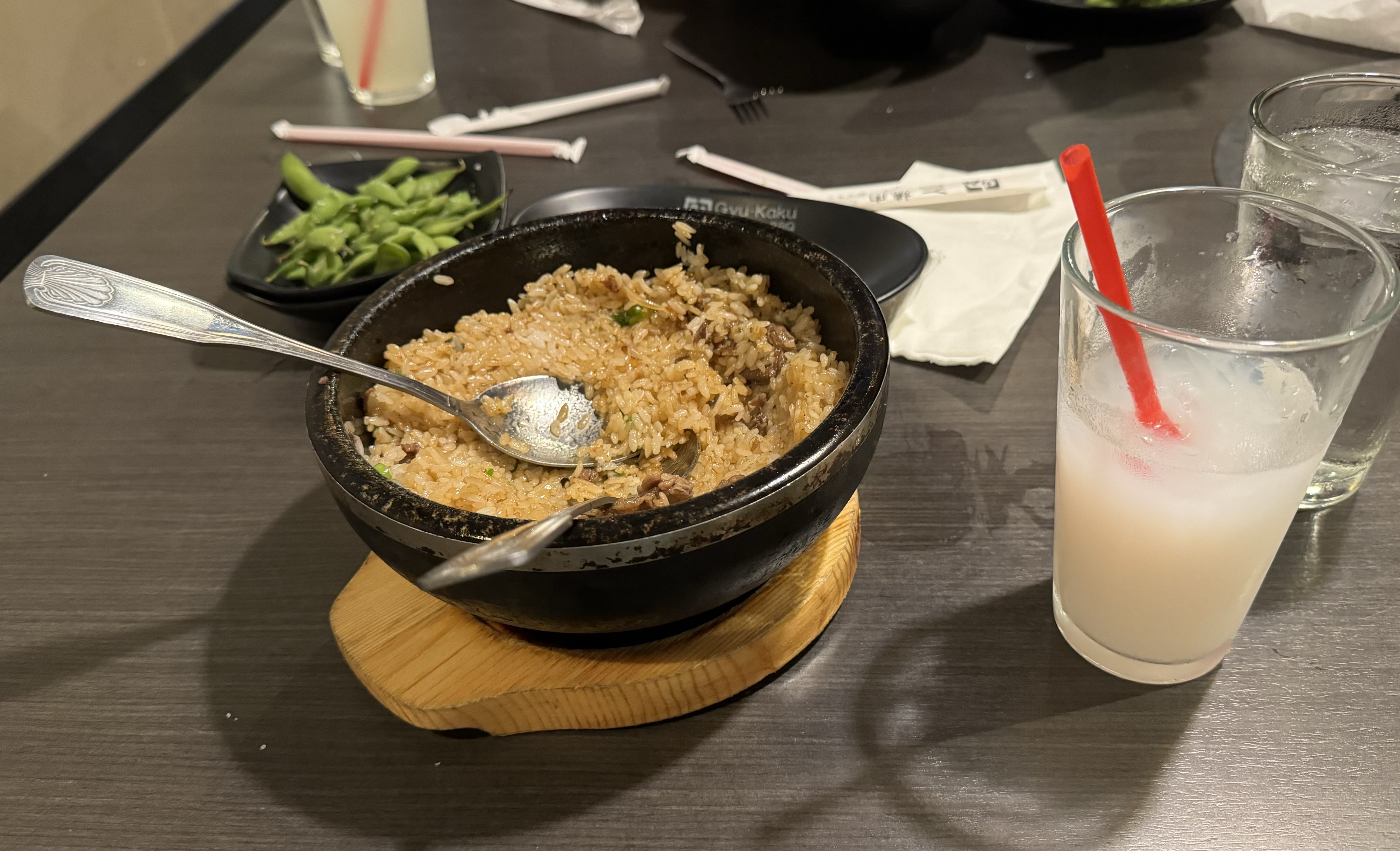 A bimbap and a partly drunk calpico from a Japanese barbecue restaurant.
