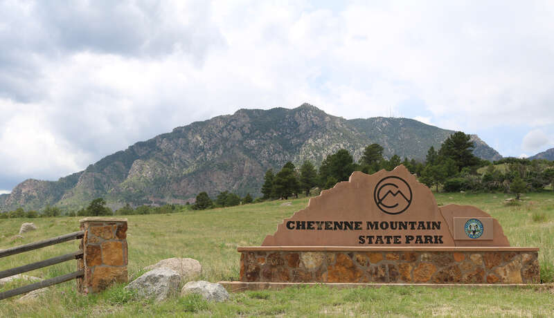 Cheyenne Mountain State Park in El Paso County, Colorado. The photo shows the sign at the park's entrance on JL Ranch Heights Road (also called State Park Road) in Colorado Springs, Colorado.