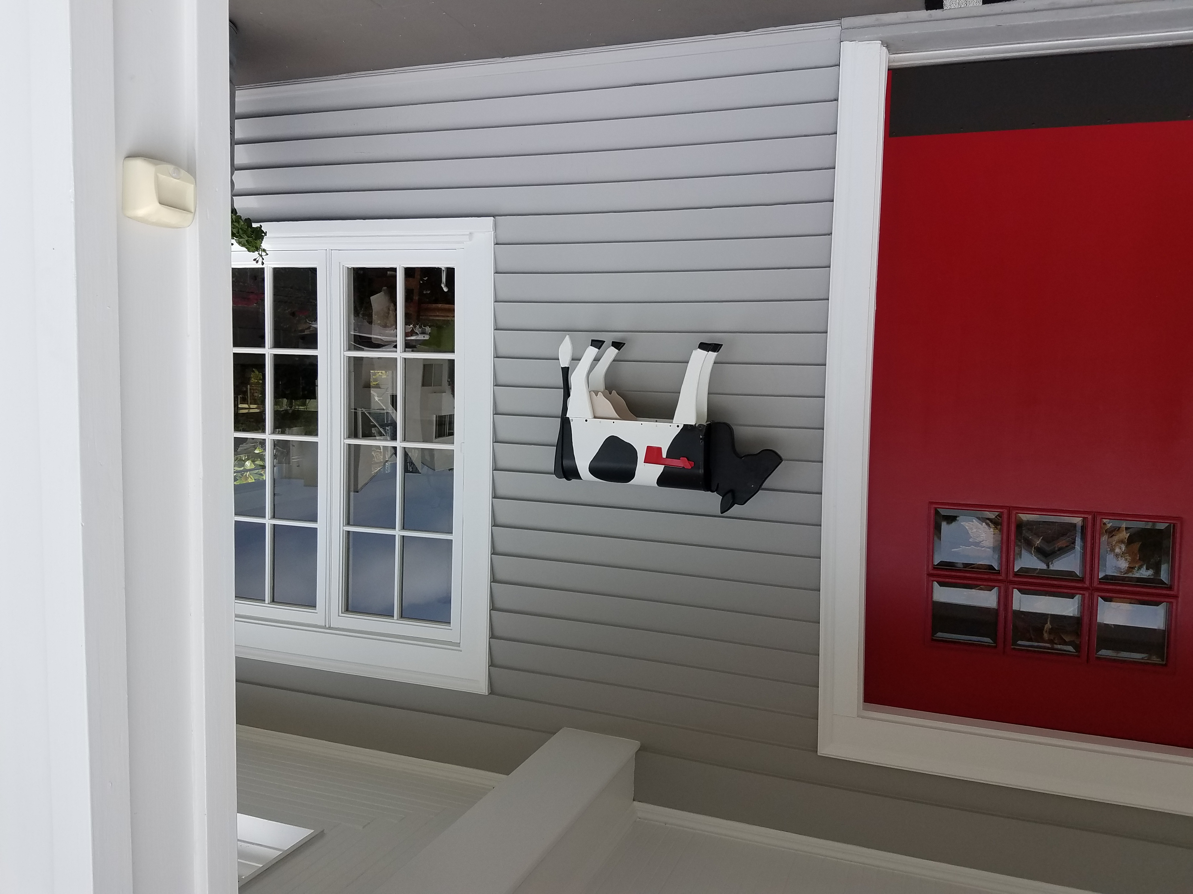 A custom cow mailbox outside 7320 Fay Avenue in La Jolla