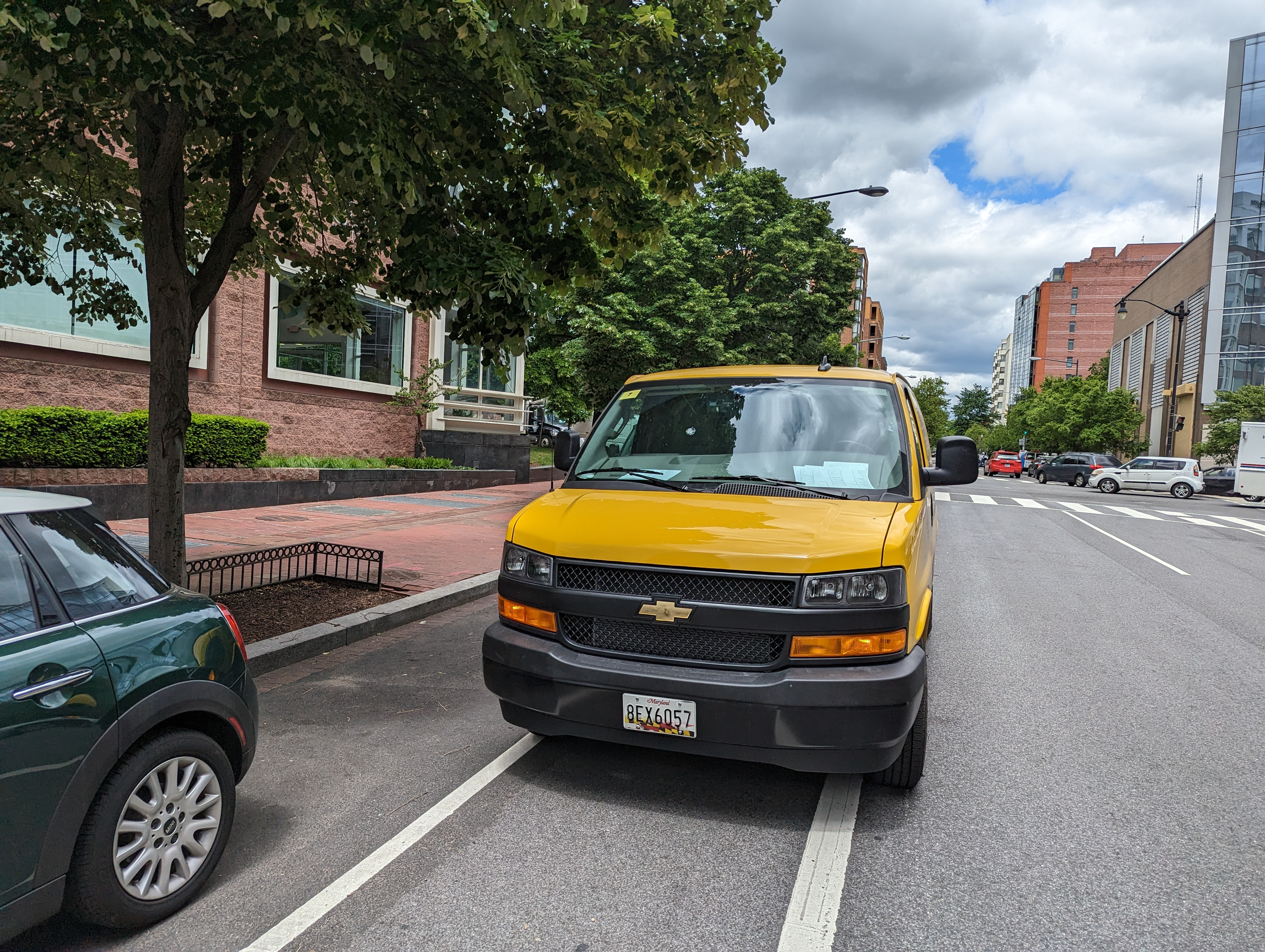 A DHL delivery van parked in a bike lane in Washington, D.C.
