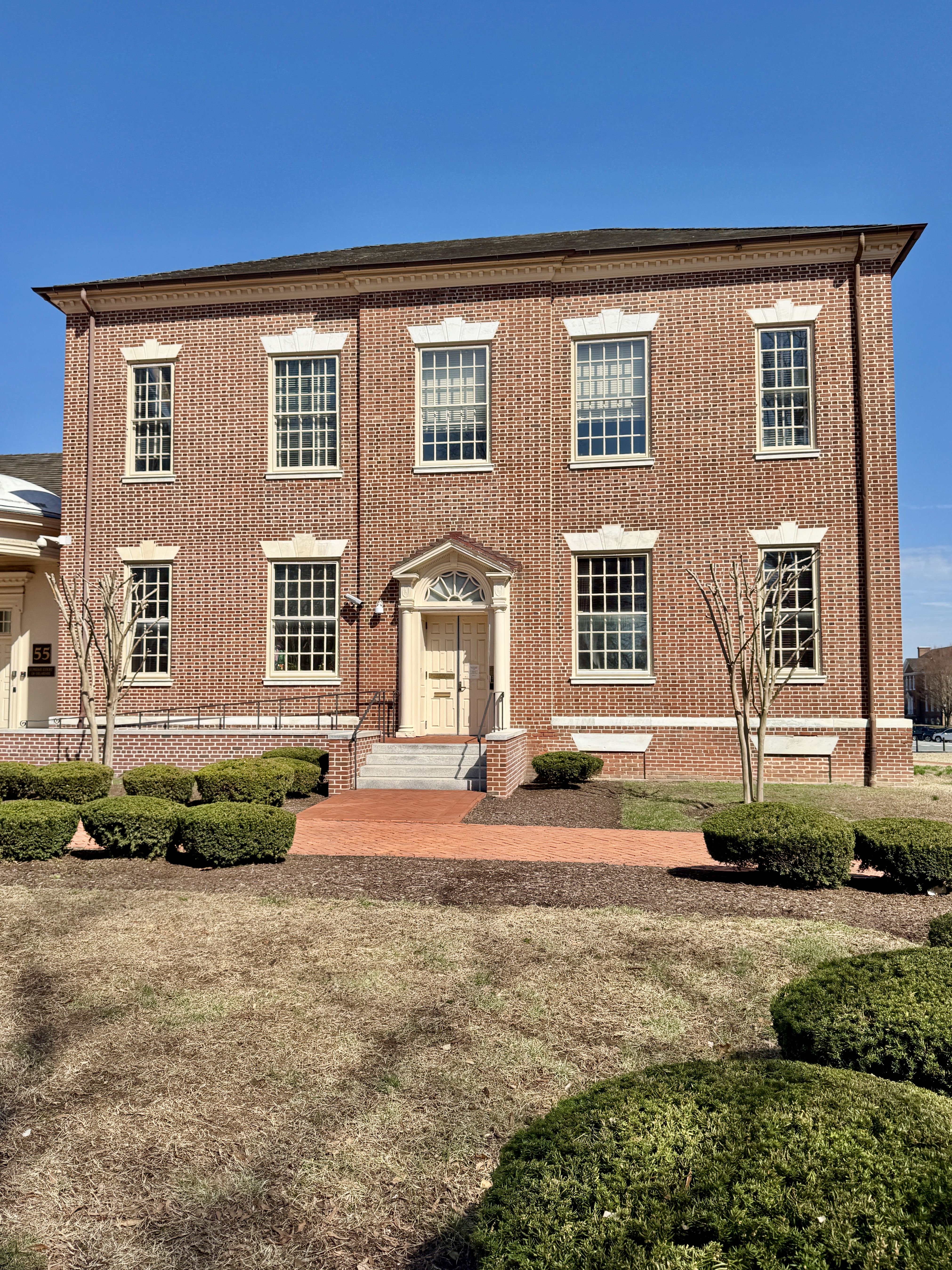 Built in 1909, this Colonial Revival-style building was originally designed by Edward L. Tilton as an addition to the Old Delaware State House, doubling the size of the old capitol, and was heavily renovated to its present appearance in 1968.  The