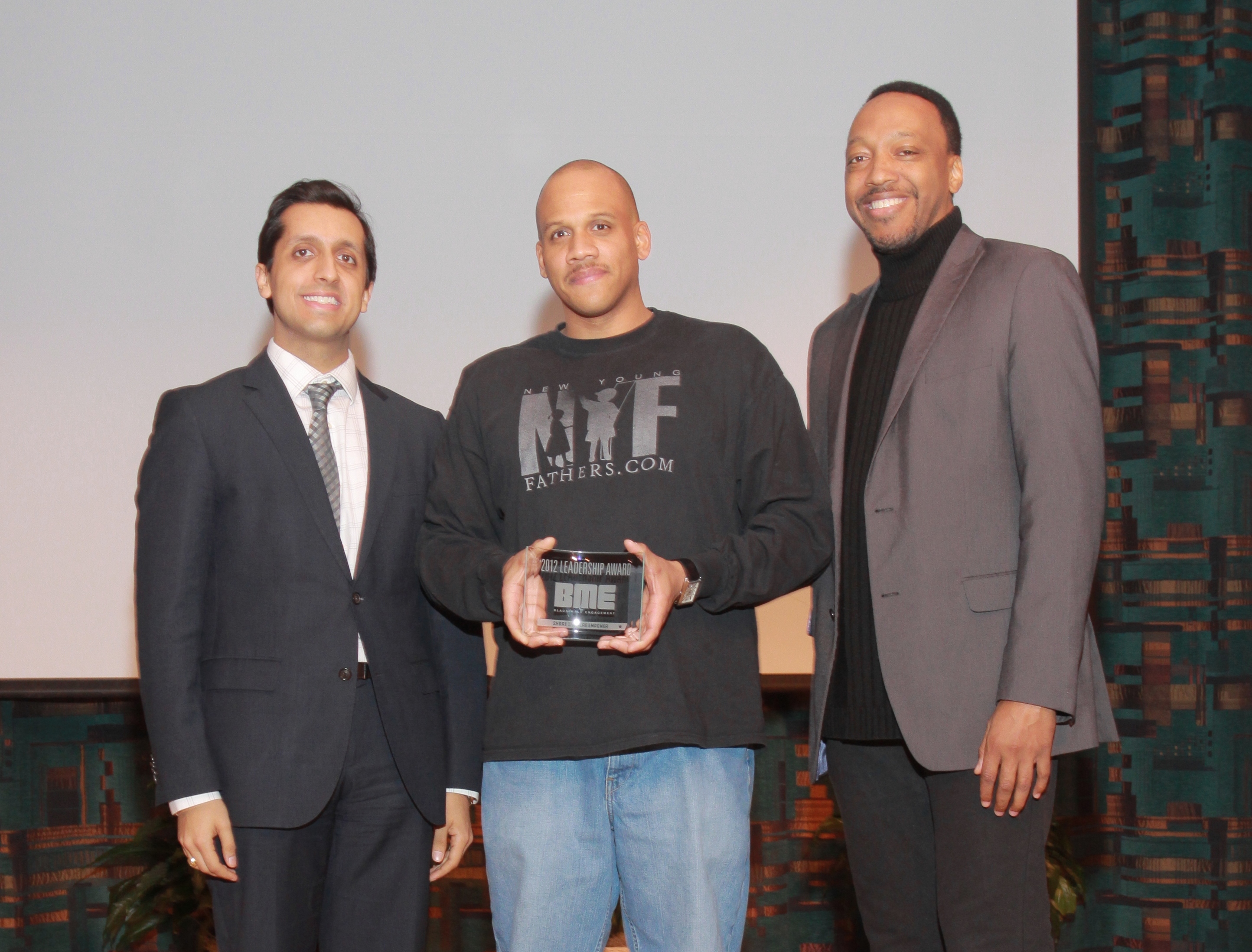 (l,r) Knight's Rishi Jaitly, award winner Andre Dandridge and Knight's Trabian Shorters