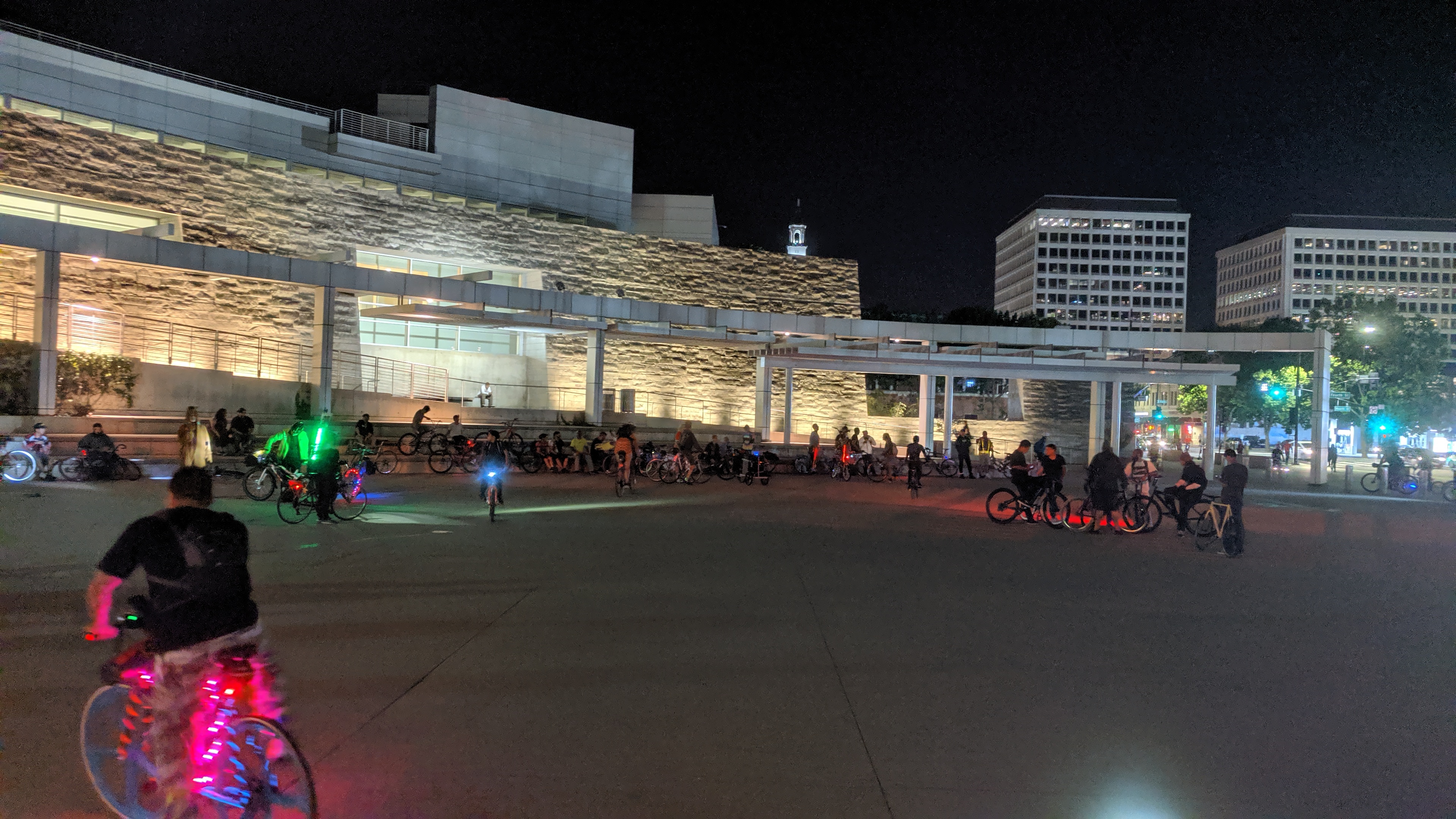 San Jose Bike Party riders begin to arrive at the end point of the ride back at the start point at San Jose City Hall. The end point is a smaller group because many riders break off toward home or vehicles before the end of the ride.
