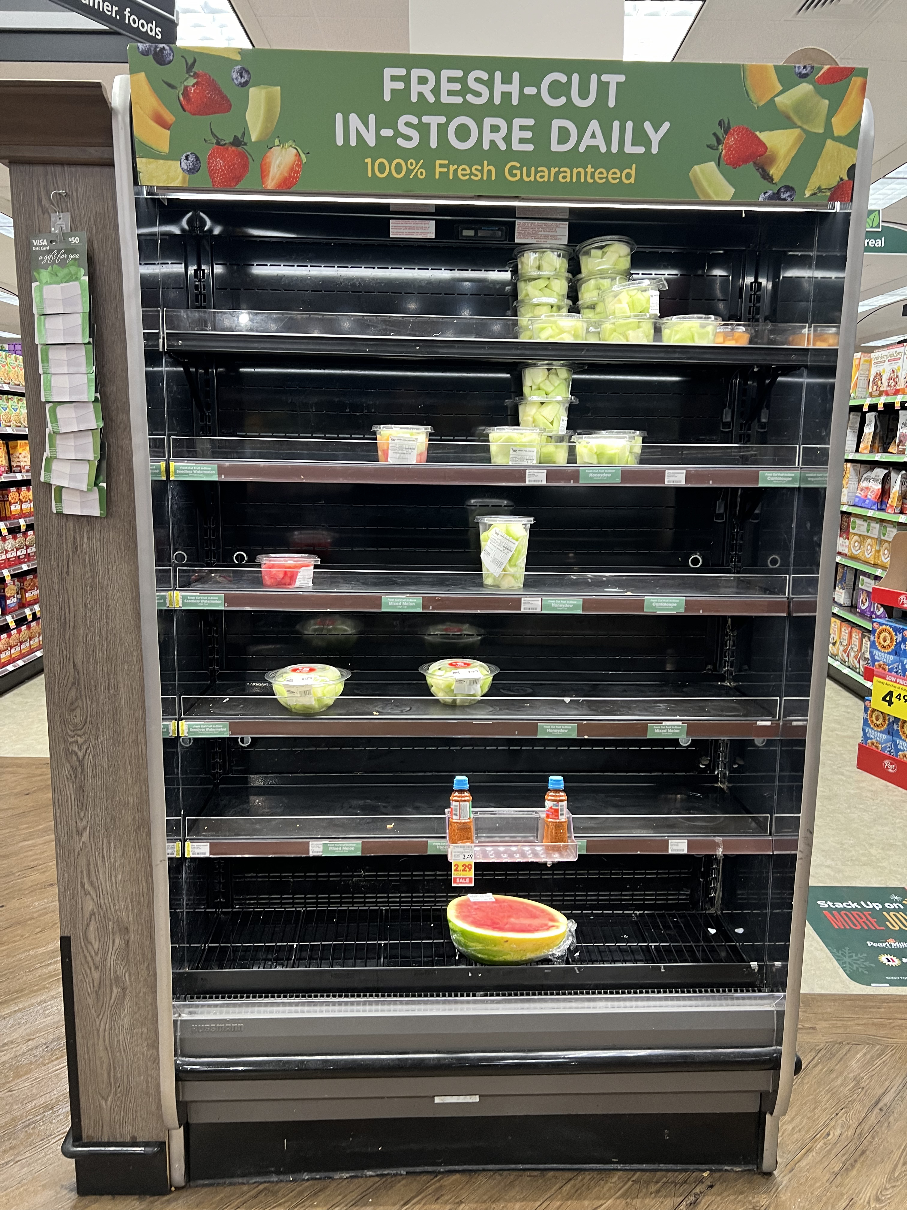 Nearly Empty Cut Fruit Shelf