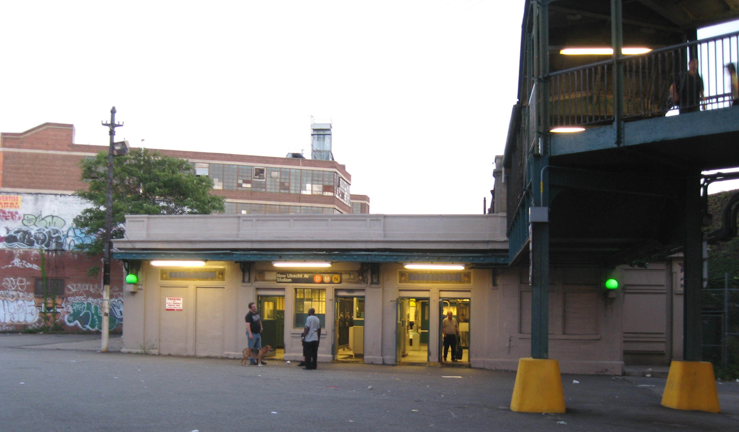 Looking southeast at dusk of a sunny day at en:New Utrecht Avenue/62nd Street (New York City Subway) station house and overhead walkway