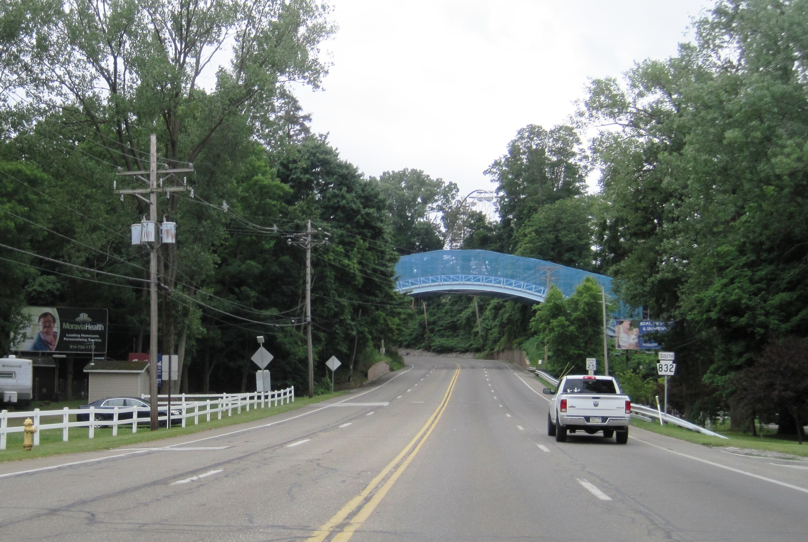 Photo of southbound Pennsylvania Route 832 (Peninsula Drive) in Millcreek Township, Erie County, Pennsylvania. Photo taken looking south between Presque Isle State Park and West 6th Street. A bridge that carries the tracks of Ravine Flyer II in