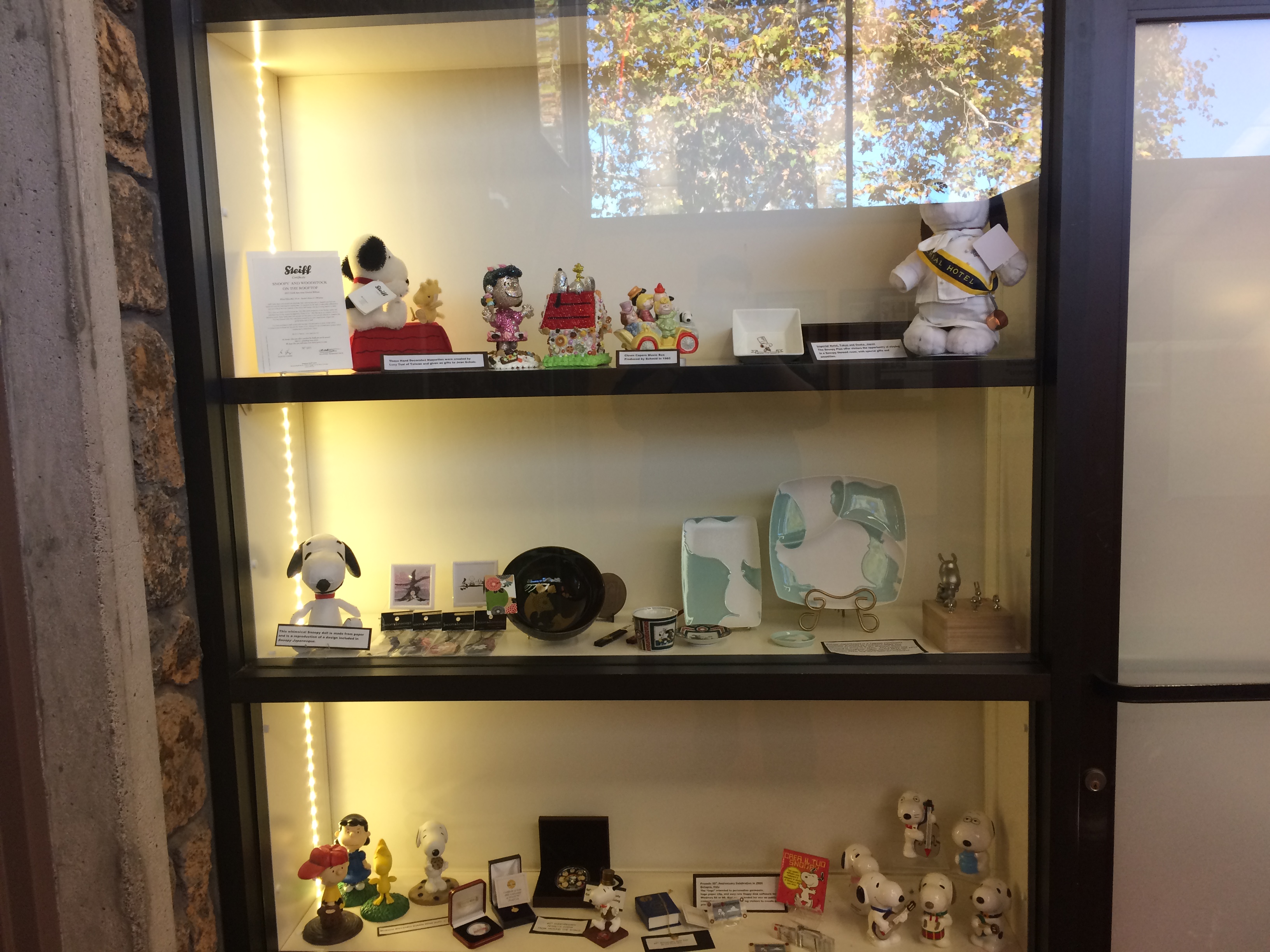 Various Peanuts statues and figurines