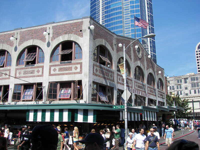 Corner of Pike Street and Pike Place in Pike Place Market, Seattle.  Fifteen Twenty-One Second Avenue is in the background.