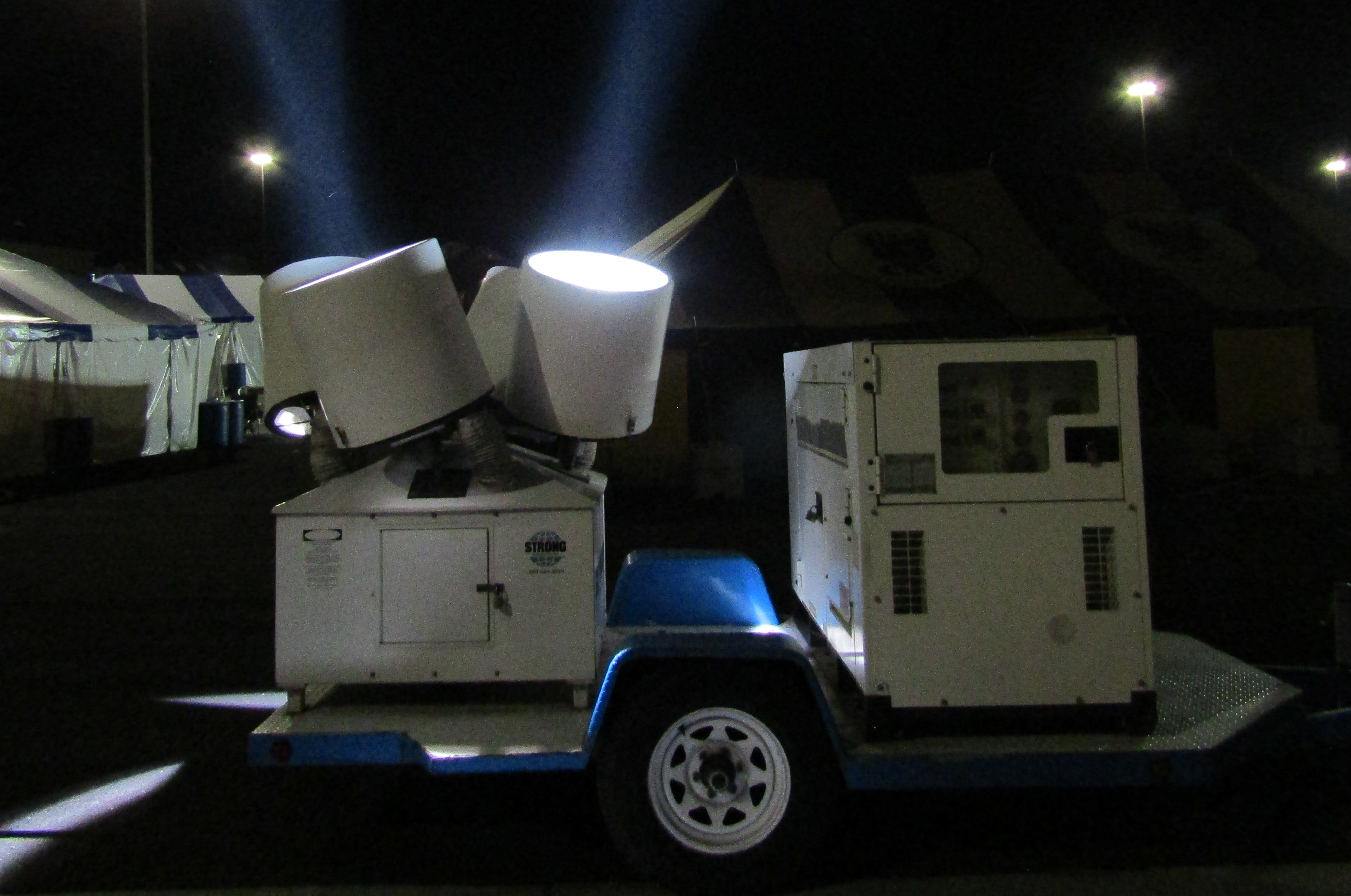 "STRONG" rotating searchlights outside a fireworks tent in South Jordan, Utah.