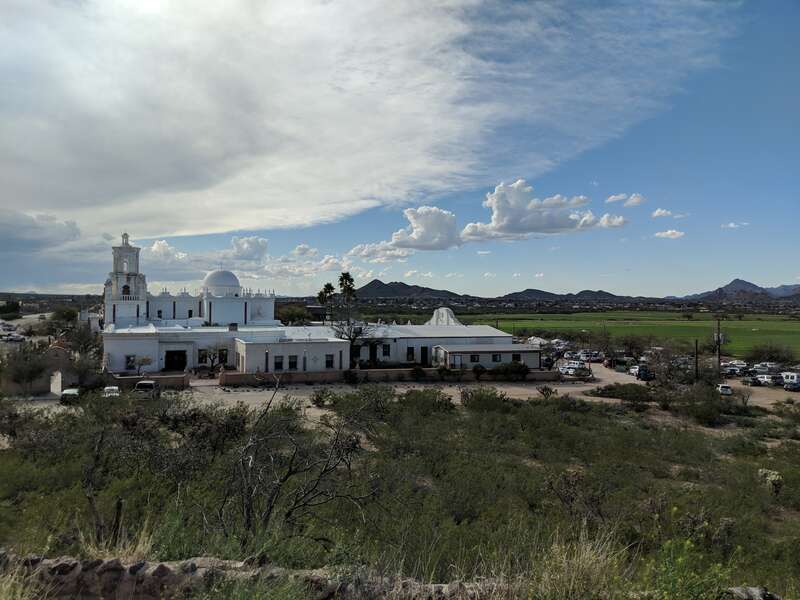 The Mission San Xavier del Bac as viewed from a hill to the east.