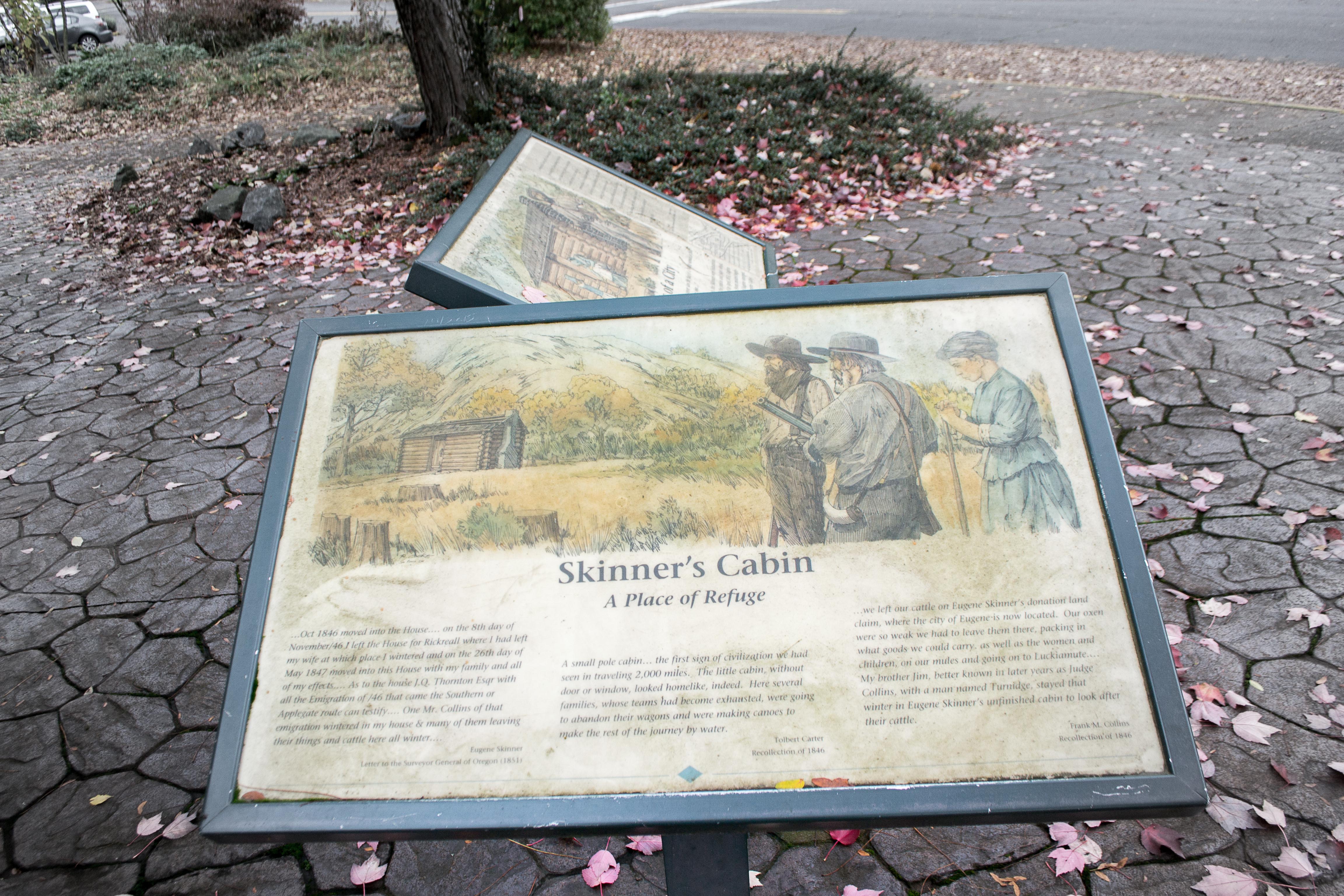 A reader board with pioneer recollections at the Skinner Cabin replica in Eugene, Oregon