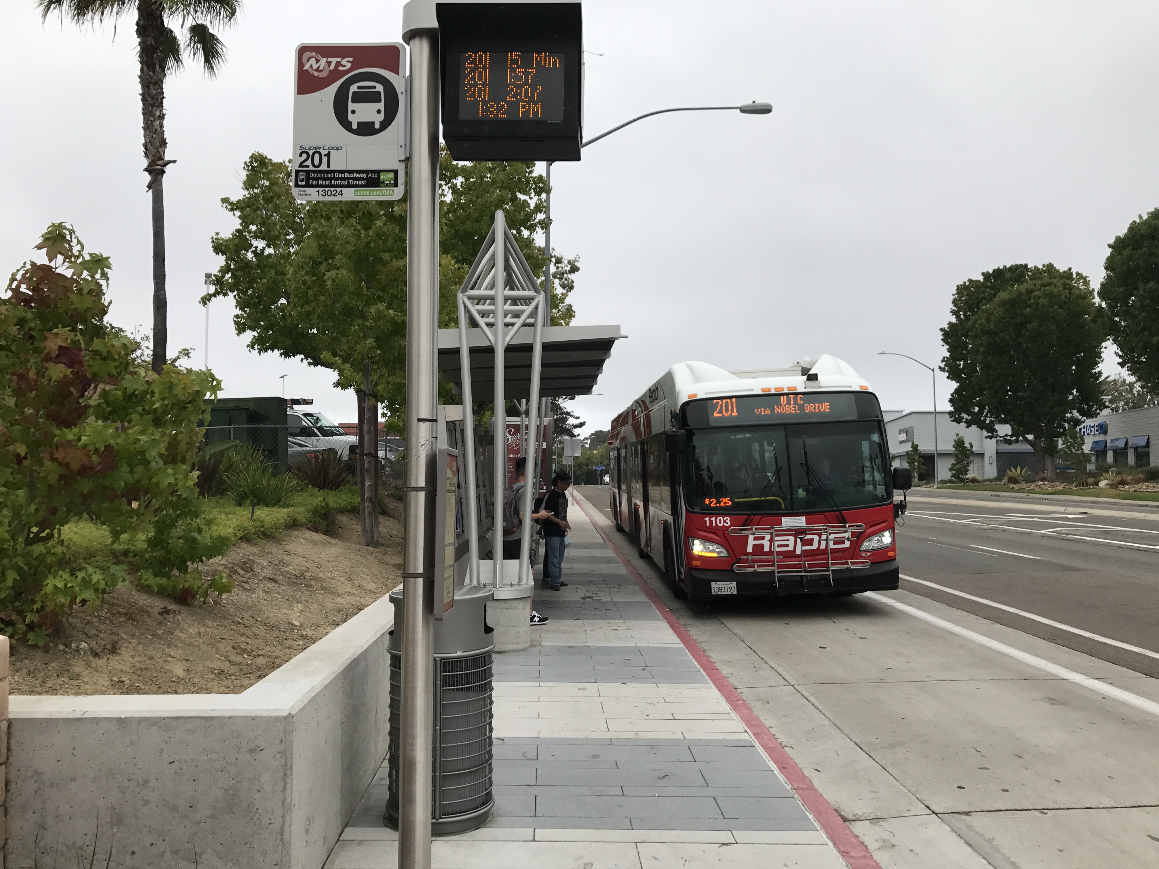 The SuperLoop station and bus at the intersection of Nobel Drive and La Jolla Village Square Driveway in La Jolla, California.