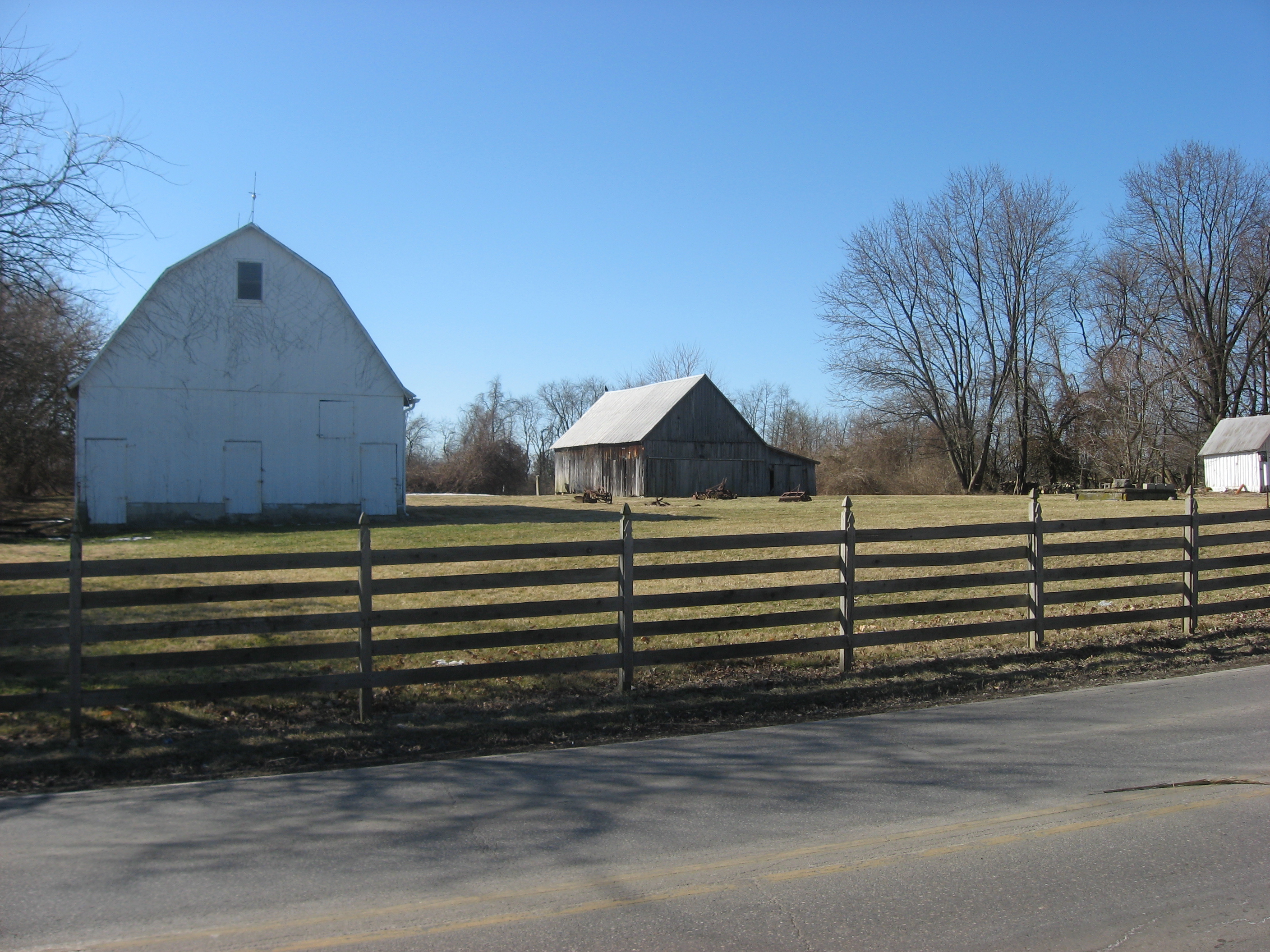 Two barns and a small outbuilding at the Hinkle-Garton Farmstead, located at 2920 E. Tenth Street in Bloomington, Indiana, United States.  The farm complex is listed on the National Register of Historic Places.