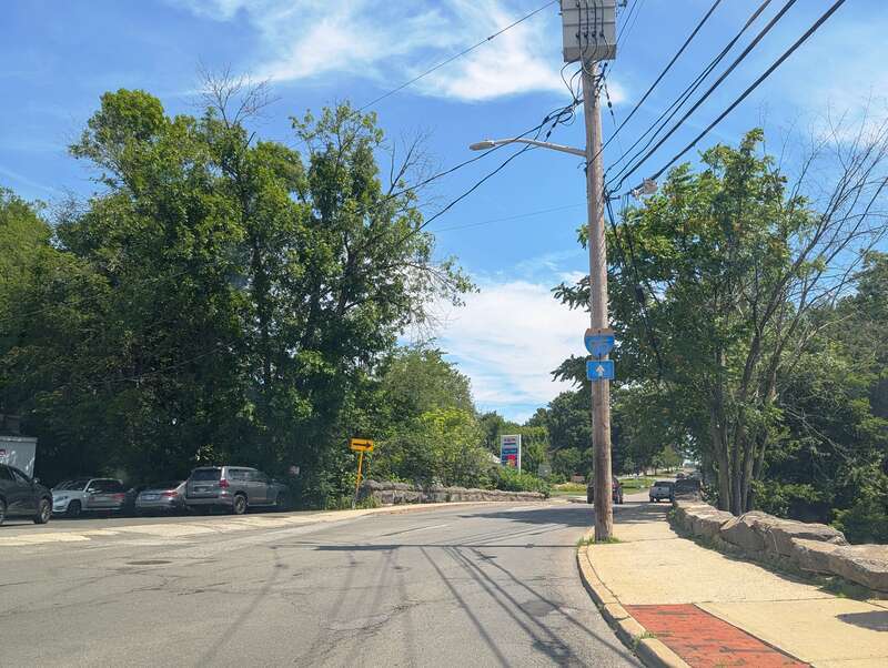 Photo of northbound U.S. Route 1 (North Main Street) in Port Chester, New York approaching a traffic circle straddling the Connecticut state line. Photo taken looking north-northeast at Putnam Avenue.