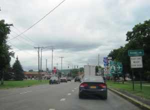 Photo of northbound Genesee Street in Utica, New York approaching River Road / Auert Avenue. This stretch of surface road with a traffic light is the way for Interstate 90/New York State Thruway travelers to reach Interstate 790. Photo taken looking